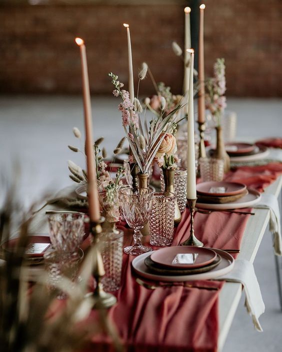 the-earthen-cutlery-with-glass-and-candles-on-the-table-top