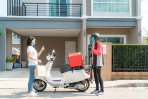 asian-woman-pick-up-delivery-food-bag-from-box-thumb-up-form-contactless-contact-free-from-delivery-rider-with-bicycle-front-house-social-distancing-infection-risk-coronavirus-concept_73503-1929
