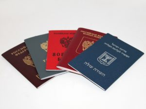 passports from different nations from immigrants moving to Canada